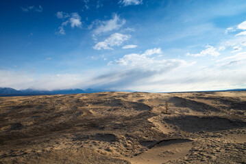 Russia. Beautiful scenery of the northernmost desert in the world. View of the Kodar Ridge. Chara sands. The region of baikaL Kodar National natural park.