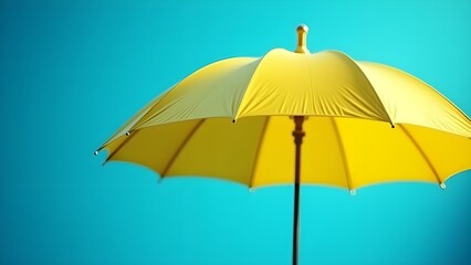 Obraz premium A bright yellow umbrella on a vivid blue background, creating a bold contrast