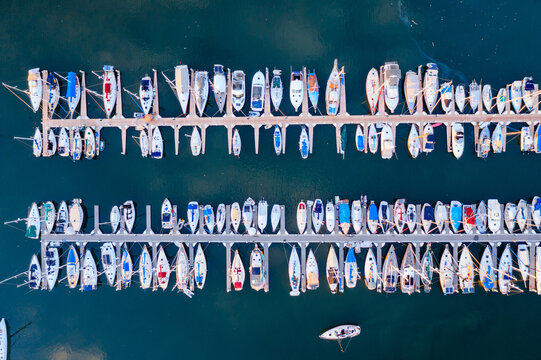 Aerial drone view of boats lined up in the harbor, Hawaii