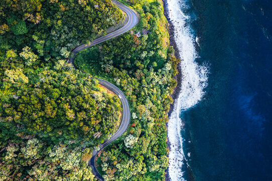 Drone view of winding road along the coast of Maui, on the famous road to Hana, Hawaii