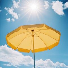 Sunny Day at the Beach: A Yellow Umbrella Under the Summer Sun