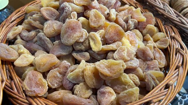 Profile view of basket full of amla candy from Afghanistan.