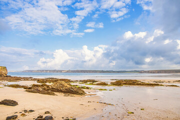 Scenic view at a sand beach by the sea in Bretagne in the summer