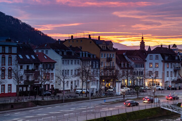 Traditional buildings and residences along the Neckar River in Heidelberg Germany. Photo taken during sunset