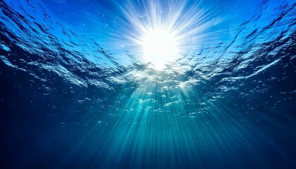 Obraz premium Under the blue sea captivating sunlight rays illuminating ocean depths