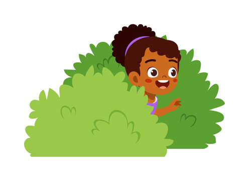 little kid play hide and seek and hiding inside bush