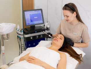 Innovative microneedling mesotherapy enhances skin rejuvenation during a relaxing beauty treatment...