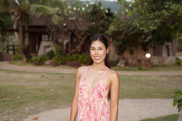 Naklejka premium Summer beach portrait of young beautiful Asian woman