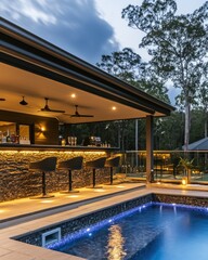 Obraz premium Outdoor Poolside Bar With Illuminated Seating Area