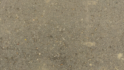 Textured concrete surface in urban environment. Detailed photo. Industrial location. Close-up view.