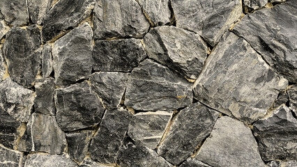 Architectural background in urban stone wall texture, outdoor environment, close up view, design material.
