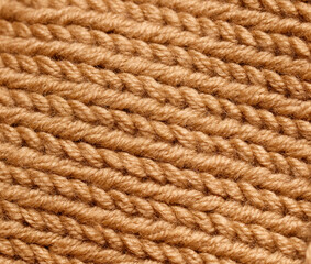 A close up of a brown yarn with many strands