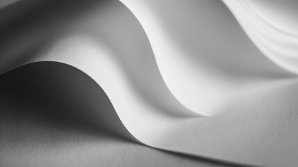 Fototapeta premium A close-up of softly curved white paper, showcasing texture and light interplay.