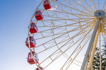 Fremantle, WA, Australia. The Tourist Wheel is a Ferris wheel that offers views of the city, harbour, and ports. It's located in Esplanade Park, a popular destination in Fremantle.