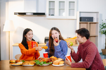 Group of Young friend having, enjoy evening party together at home. Attractive young man and woman having fun