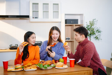 Group of Young friend having, enjoy evening party together at home. Attractive young man and woman having fun