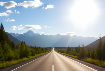 Naklejka premium Scenic mountain highway, long straight road, majestic mountain range backdrop, lush green trees lining the road, bright sunlight, clear blue sky with wispy clouds, empty asphalt road with painted line
