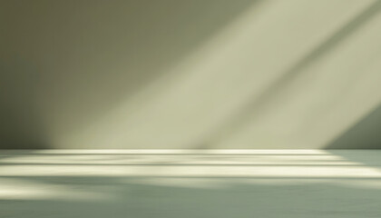 Minimalist abstract light background for product presentation in green tones. Soft shadow from the window on empty wall.