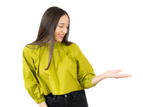 Young woman isolated on transparent background showing a copy space on a palm and holding another hand on waist. PNG transparent.
