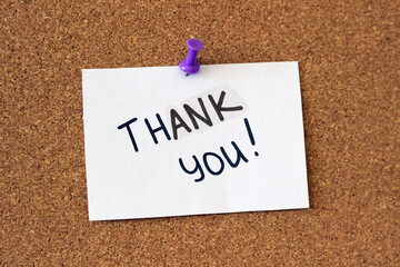 push pin piece of paper that says 'Thank you!', appreciation concept, corkboard reminder