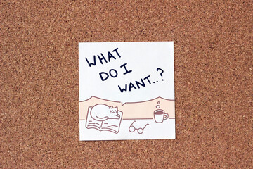 sticky note with a cat on a corkboard that says 'What do I want?', self-determination and career...