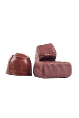 chocolate with filling inside. there are three of them. one candy is round. close-up. there are three of them.