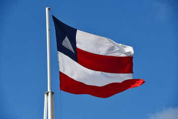 Beautiful flag of the state of Bahia on a sunny summer day with blue sky. Flag of Bahia, Brazil