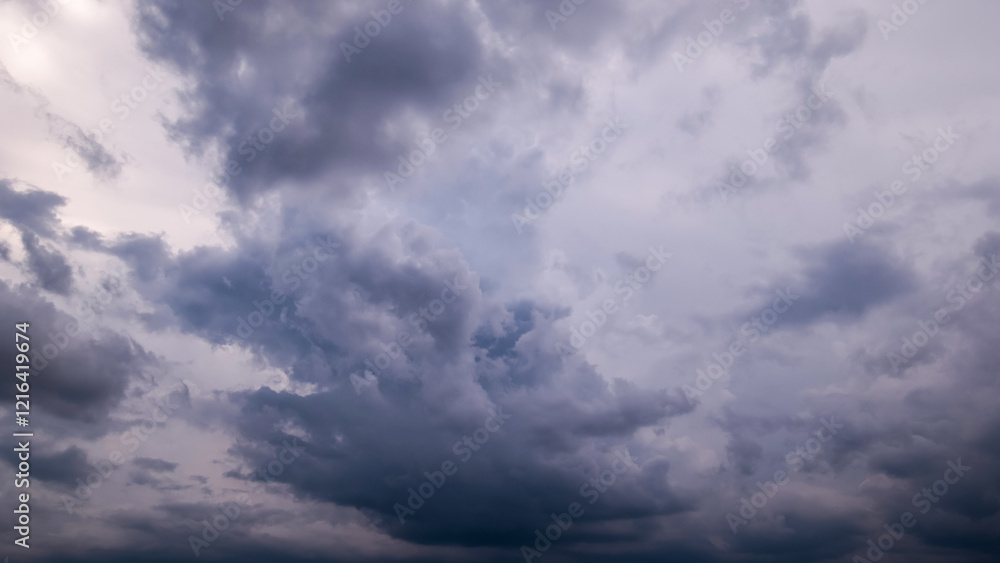 Wall mural dark sky with stormy clouds. dramatic sky rain,dark clouds before a thunder-storm.