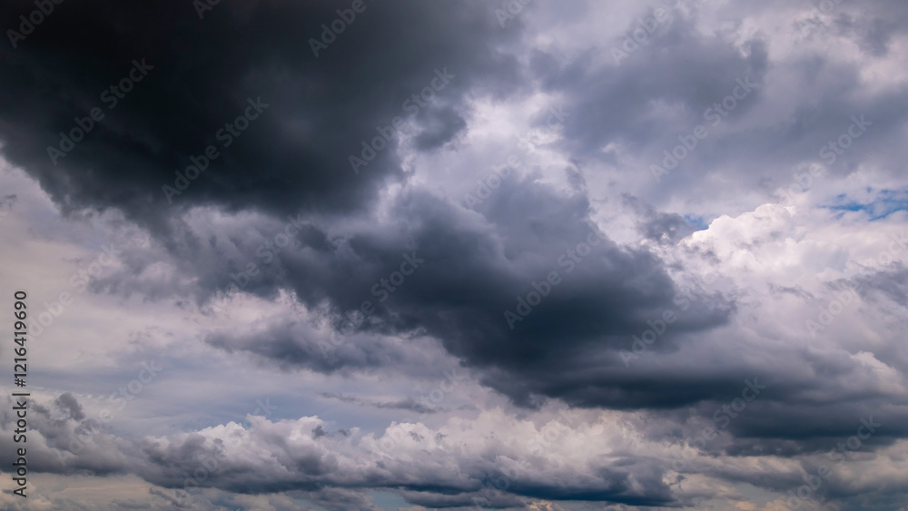 Wall mural dark sky with stormy clouds. dramatic sky rain,dark clouds before a thunder-storm.