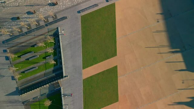 Aerial shot of Ebrington Square in Derry-Londonderry, NI on a bright and sunny day. The camera begins on ground level and rises to reveal the square. Filmed in 4K at 60fps and in Rec709 color space.