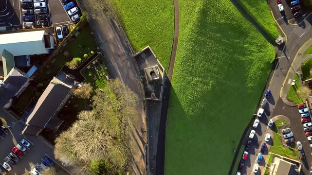 Overhead aerial of The Derry Walls in Derry-Londonderry, Northern Ireland on a bright sunny day. Filmed in 4K at 30fps with Rec709 color.