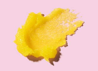 scrub cream texture on pink background skin care concept