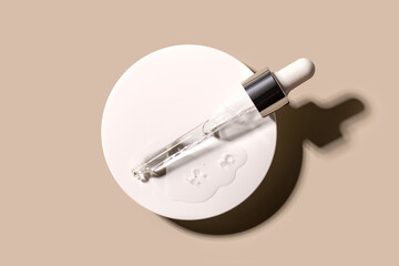 serum tests glass pipettes with drops of serum on a light beige background