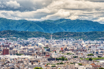 Scenic aerial view with kyoto city and the iconic Nidec Kyoto Tower located next to the train station.