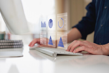investment and finance concept, businessman holding virtual trading graph and blurred light on...