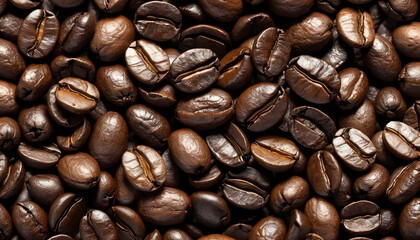 Obraz premium Close-up of roasted coffee beans, perfect for coffee shop promotions. A high-resolution close-up view of numerous roasted coffee beans