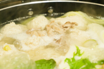 Hot pot with chicken meatballs and vegetables as ingredients, often eaten in winter in Japan