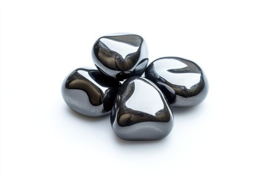 Mineral samples of hematite displaying polished surfaces and rich metallic luster under studio lighting