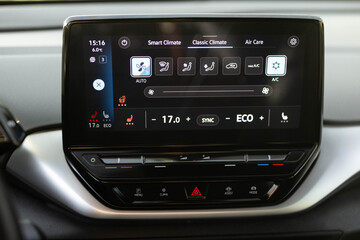 Switching ON heated seats of car by pressing the buttons. Heated seat dashboard in a car. Steering...