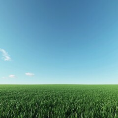 Obraz premium Green field under a clear blue sky; idyllic nature scene for background use