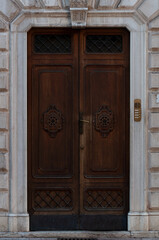 old wooden door and carvings, Italy city of Trento