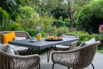 Garden patio breakfast, tranquil setting, outdoor furniture, lush greenery, relaxation