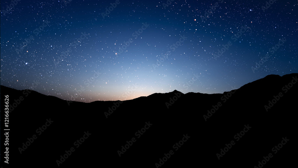 Wall mural a movement of stars in the night sky with the view of mountains..