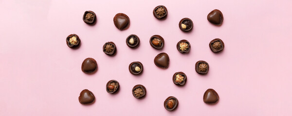 Different kinds of chocolates on colored table close-up. Top View and Flat Lay
