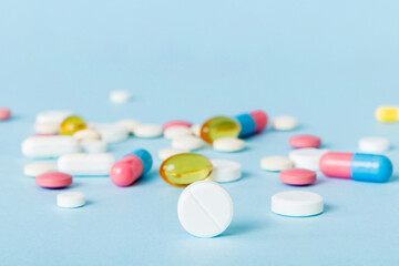 Many different colorful medication and pills perspective view. Set of many pills on colored...