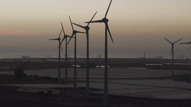 Turbines and Skies: Renewable Energy at Sunrise in Gran Canaria, Canary Islands, Spain.