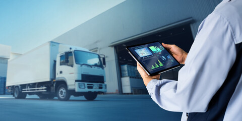 Gps tracking logistic warehouse manangement system concept.Man hand using digital tablet on blurred...