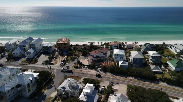 Luxury homes and condos along the Gulf Coast near Laguna Beach at Panama City Beach. White sands, Highway 30A, and summer sunshine illustrate the American dream of coastal living in Northwest Florida
