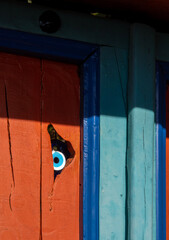Amulet Evil Eye at the door of a traditional Greek house in the mountains of Epirus in Greece