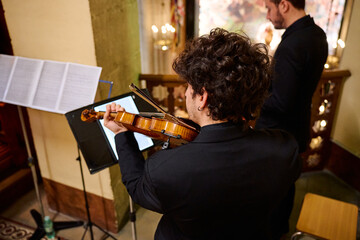 Musicians perform a classical concert in a historic church setting